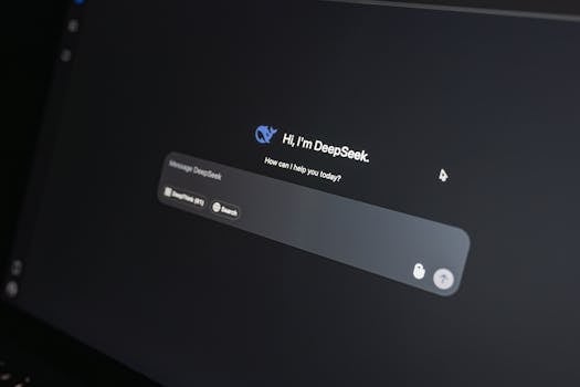 Close-up of DeepSeek AI chat interface on a laptop screen in low light.
